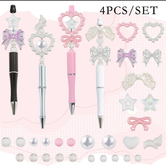 Pearl and bow beadable pen kit - four black, silver, pink and white pens with pearl heart frames, iridescent bows, angel wings and star acrylic beads